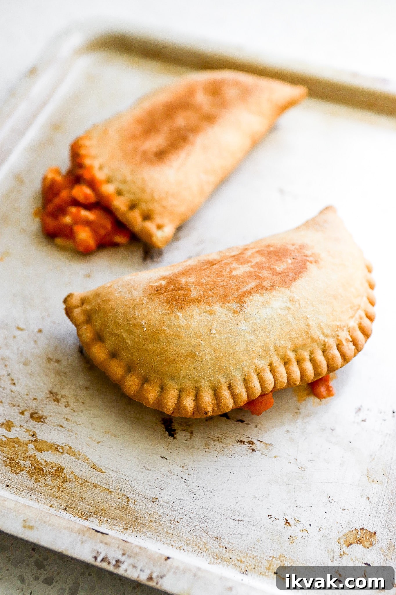 Crispy Air Fryer Frozen Pizza Pops Recipe 3 Side view of air fryer pizza pops on air fryer tray.