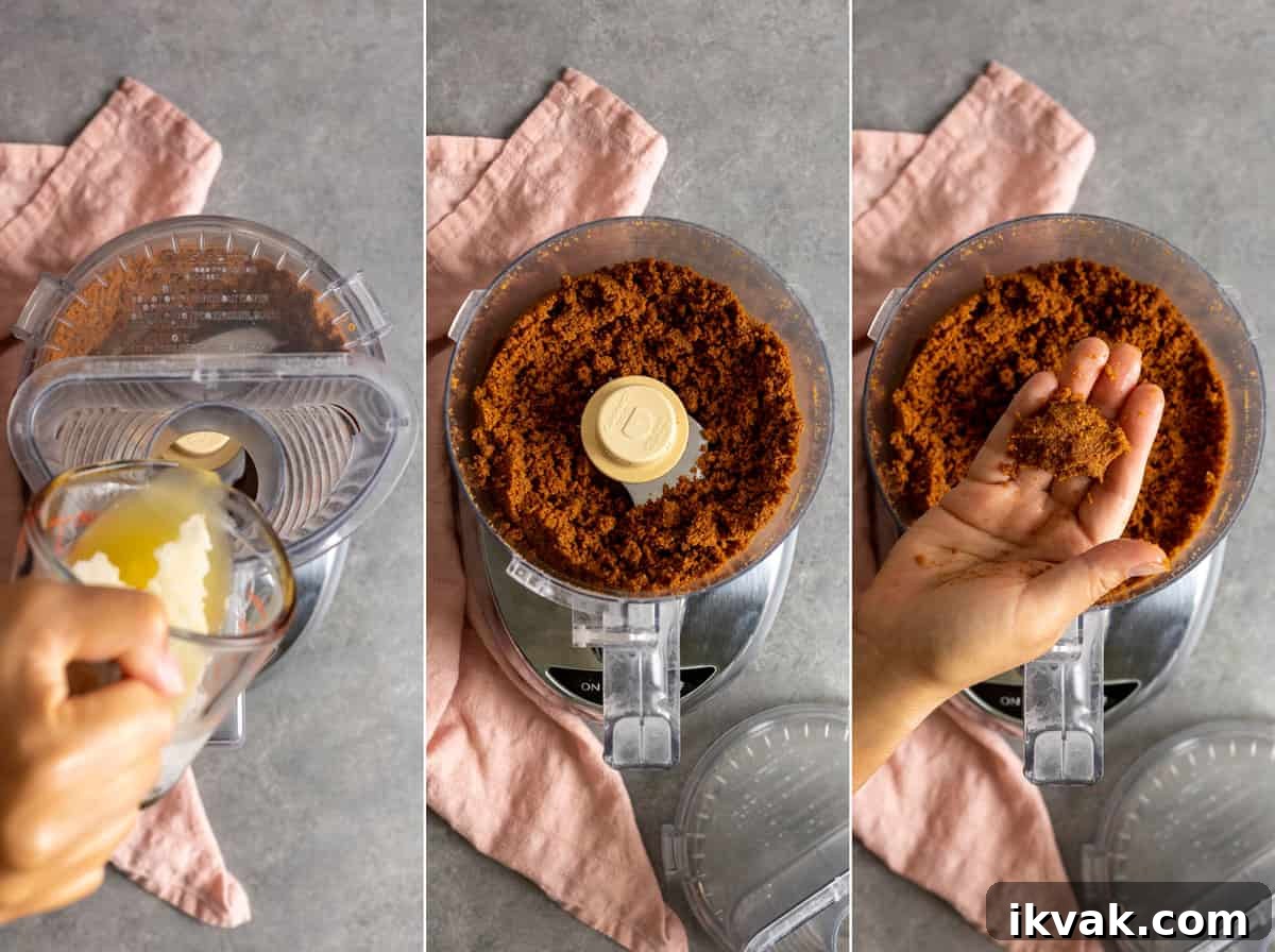 Adding butter to ground biscoff cookies.