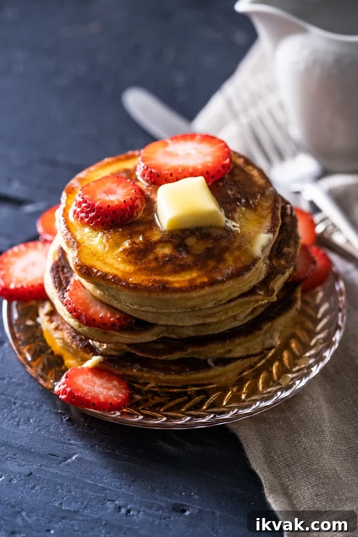 Keto Lupin Pancakes: Extra-Fluffy Low-Carb Recipe 3 A stack of gluten free & keto pancakes with a pat of butter