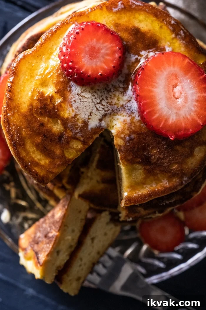 Keto Lupin Pancakes: Extra-Fluffy Low-Carb Recipe 4 Overhead shot of cut into keto pancakes with strawberry slices
