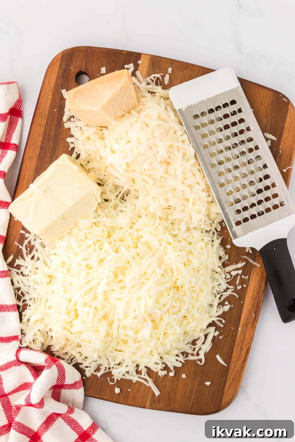 Vegetarian Baked Spaghetti with Mozzarella and Roasted Veggies 6 grated cheese on a cutting board