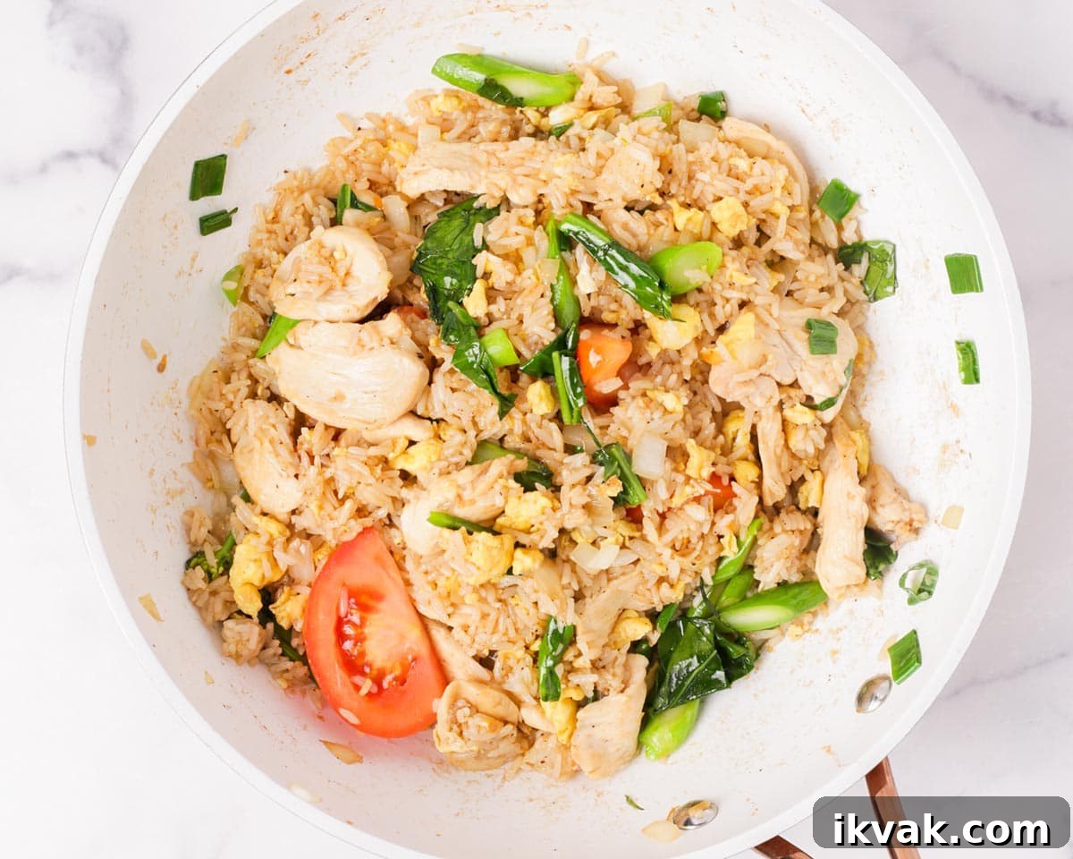 Thai fried rice finished cooking in the pan.