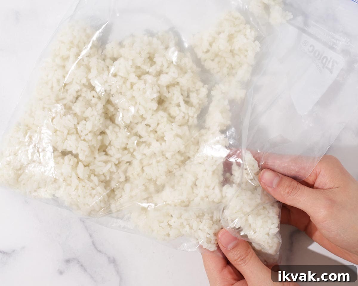 Breaking rice up in bag.