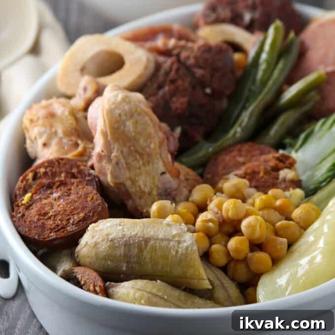 Cocido: Traditional Spanish Stew Recipe and Serving Guide 7 platter of cocido with beef shanks, chicken, ham, saba bananas, Chorizo de Bilbao, pechay