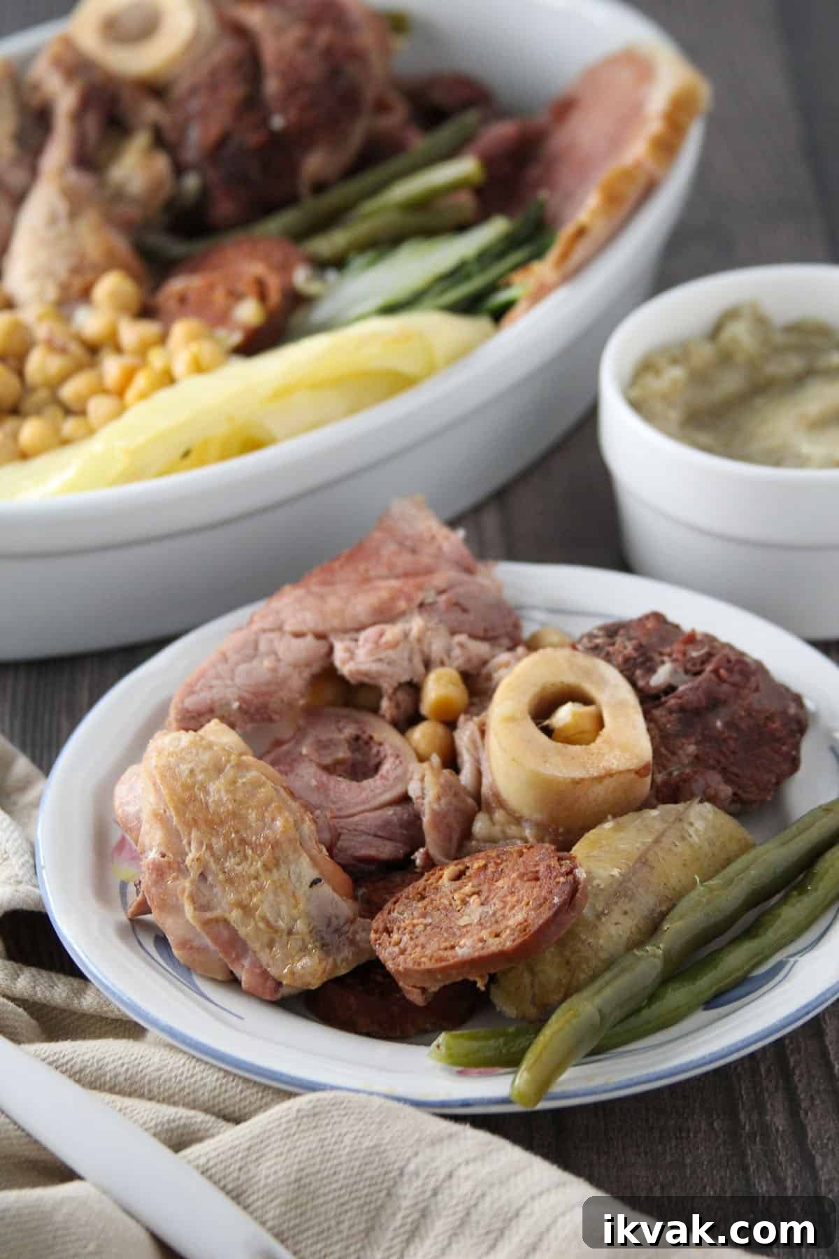 Cocido: Traditional Spanish Stew Recipe and Serving Guide 6 Cocido Madrileno in a serving bowl