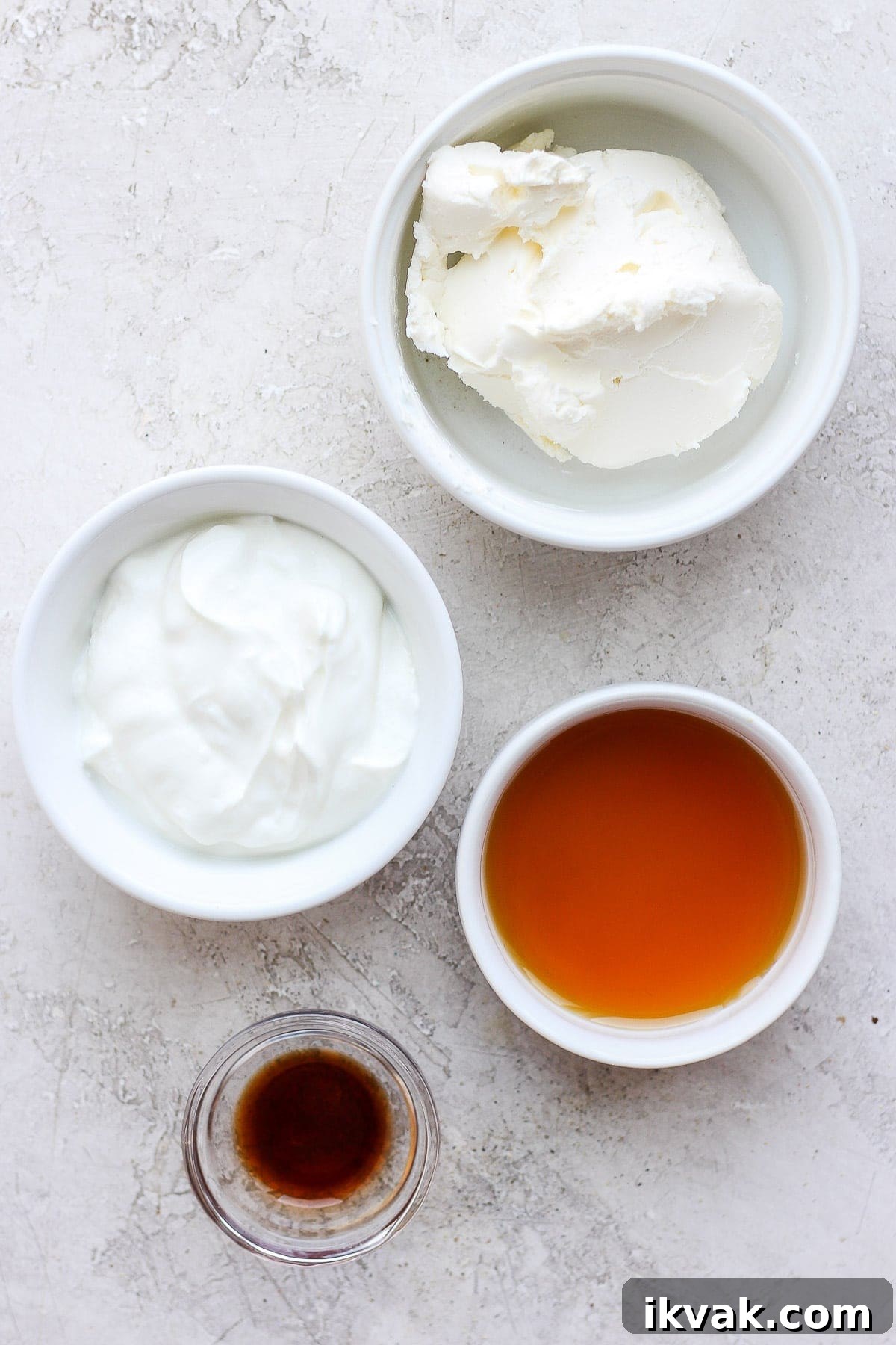 Cream cheese frosting ingredients in bowls.