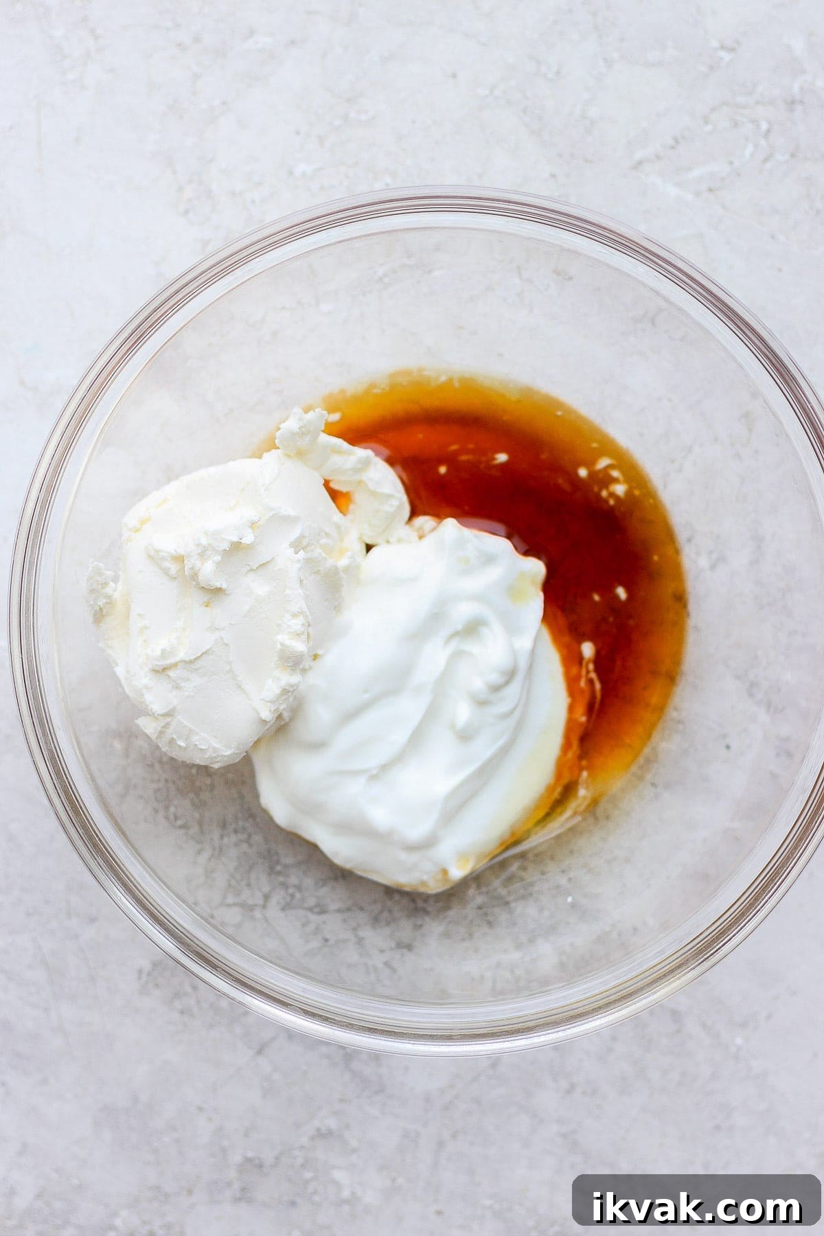 Cream cheese frosting ingredients in a bowl.