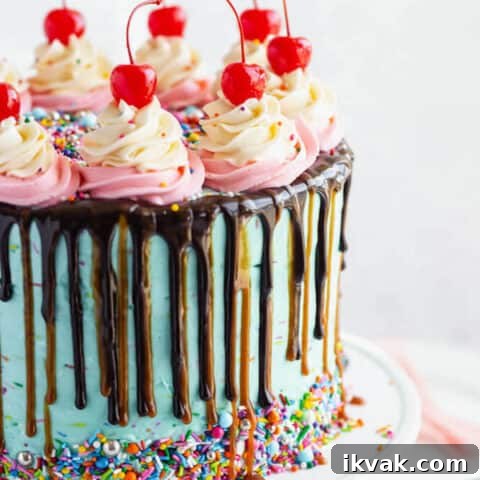 chocolate cake filled with vanilla sprinkle, caramel and chocolate buttercream and covered in a teal sprinkle frosting, topped with maraschino cherries and decorated with more sprinkles.