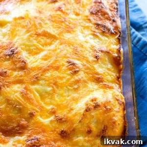 Scalloped Potatoes - a classic dish with potatoes, cheesy sauce, and baked until perfection!