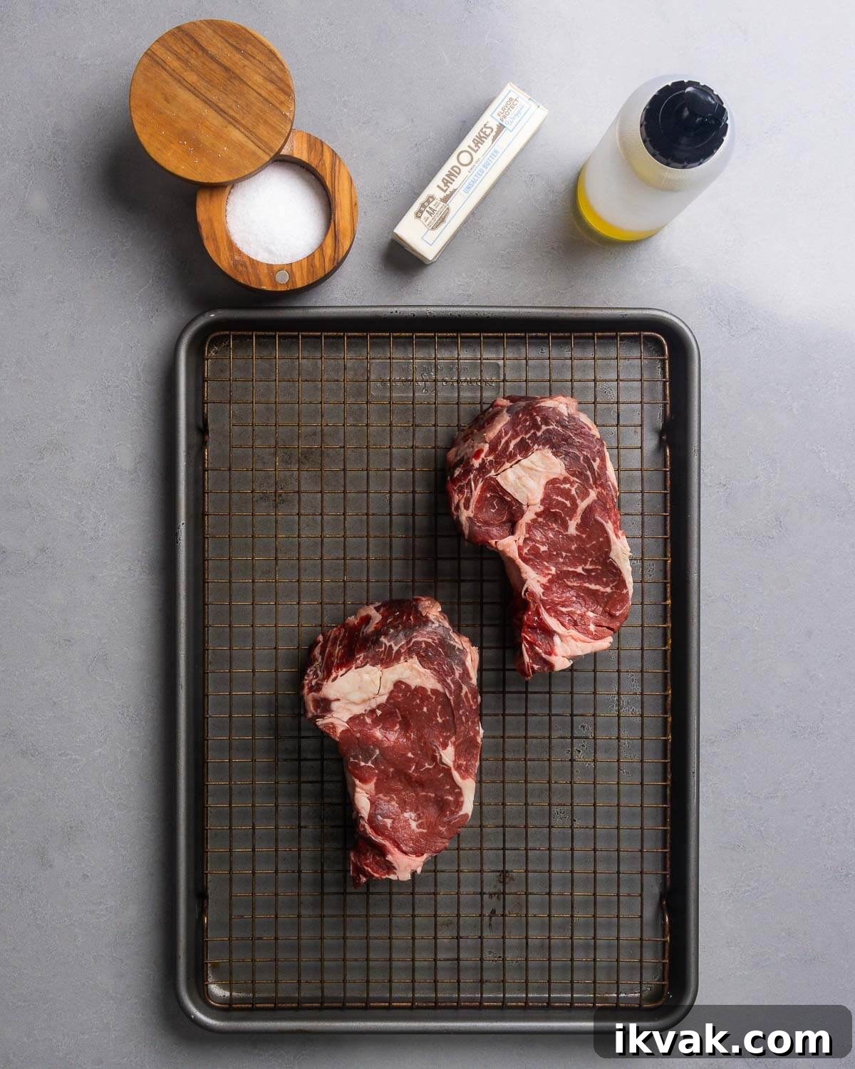 Ingredients shown: salt, butter, neutral oil, and ribeye steaks.