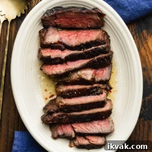 Reverse seared sliced ribeye steak in butter.