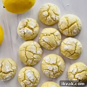 overhead photo of soft lemon cookies on a white countertop.
