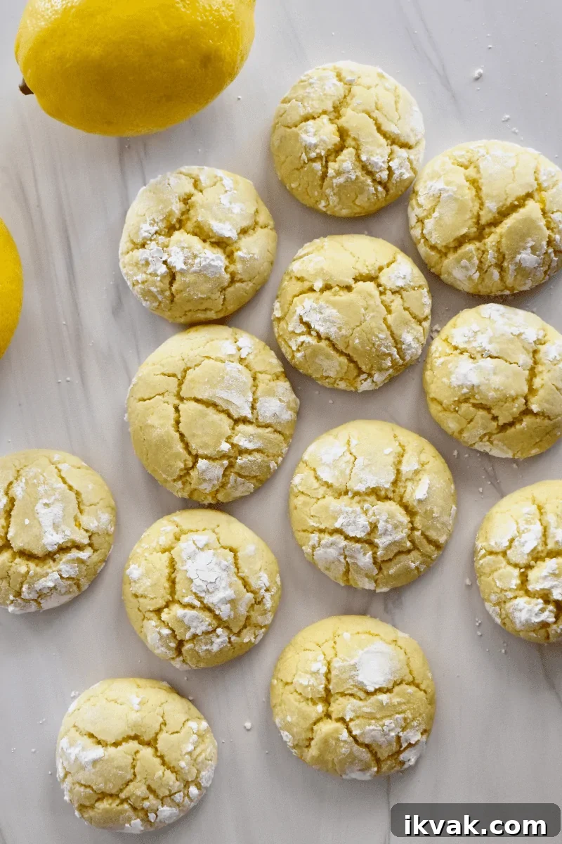 overhead photo of soft lemon cookies on a white countertop. 