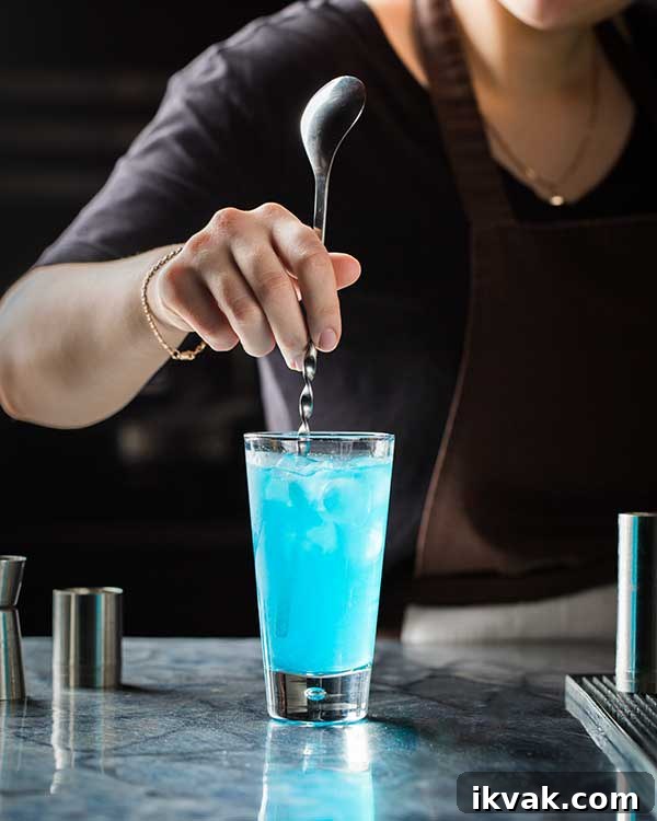 stirring a glass of Angelo Azzurro