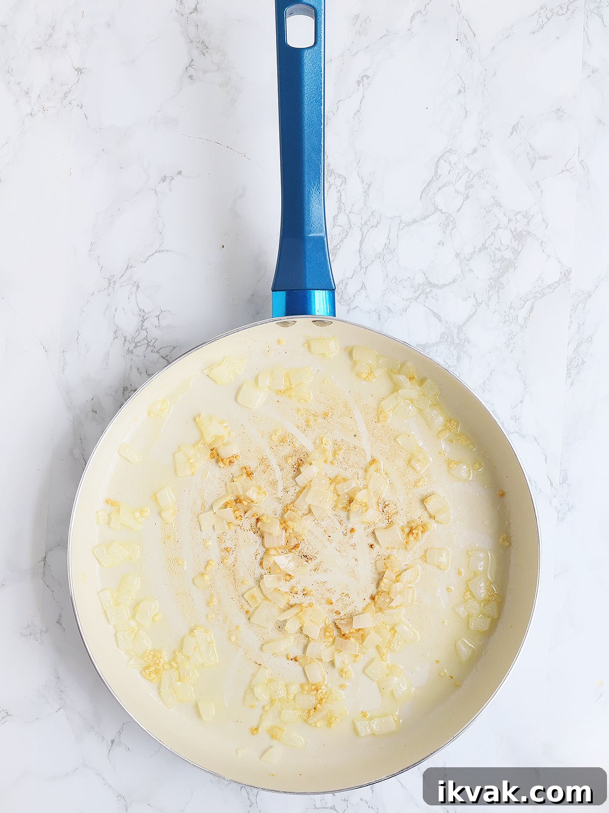 sauteed onions and minced garlic in a skillet
