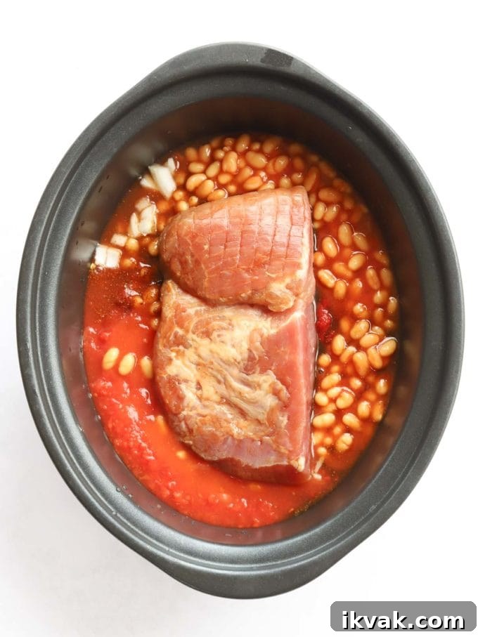 Uncooked ham in slow cooker with beans for the recipe Campfire Stew.