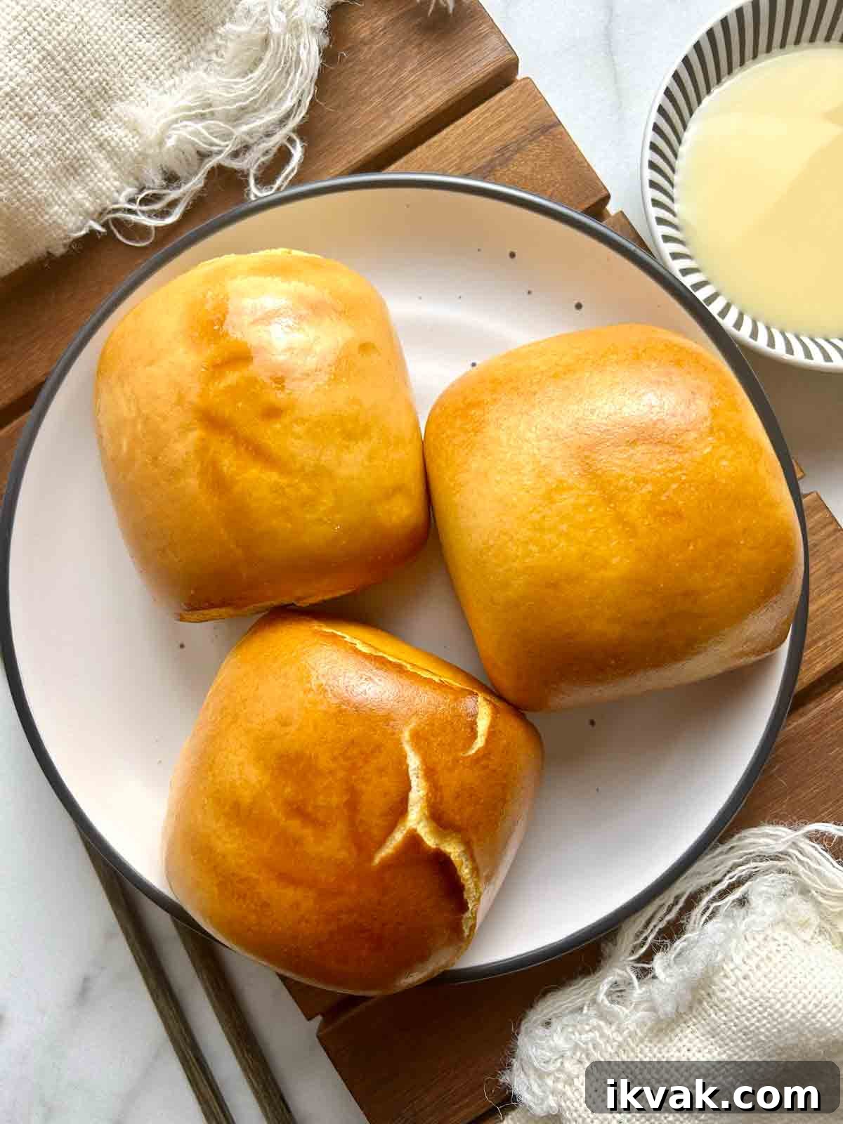 overhead shot of fried mantou in plate with side of condensed milk