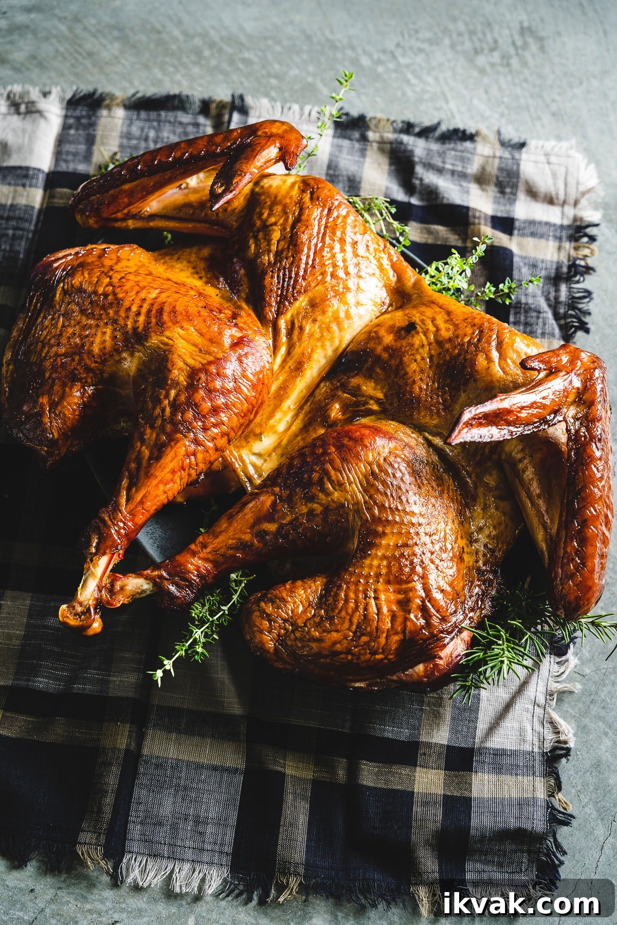 plated spatchcock smoked turkey on serving tray vertical