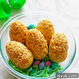 Easter eggs made out of rice krispie treats and filled with M&M's.