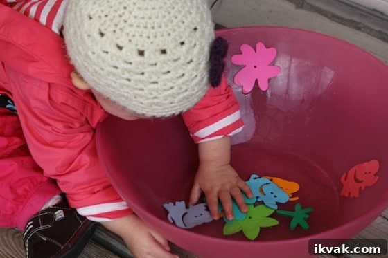 foam shapes in a wet bowl. Great fine motor activity for toddlers and babies.