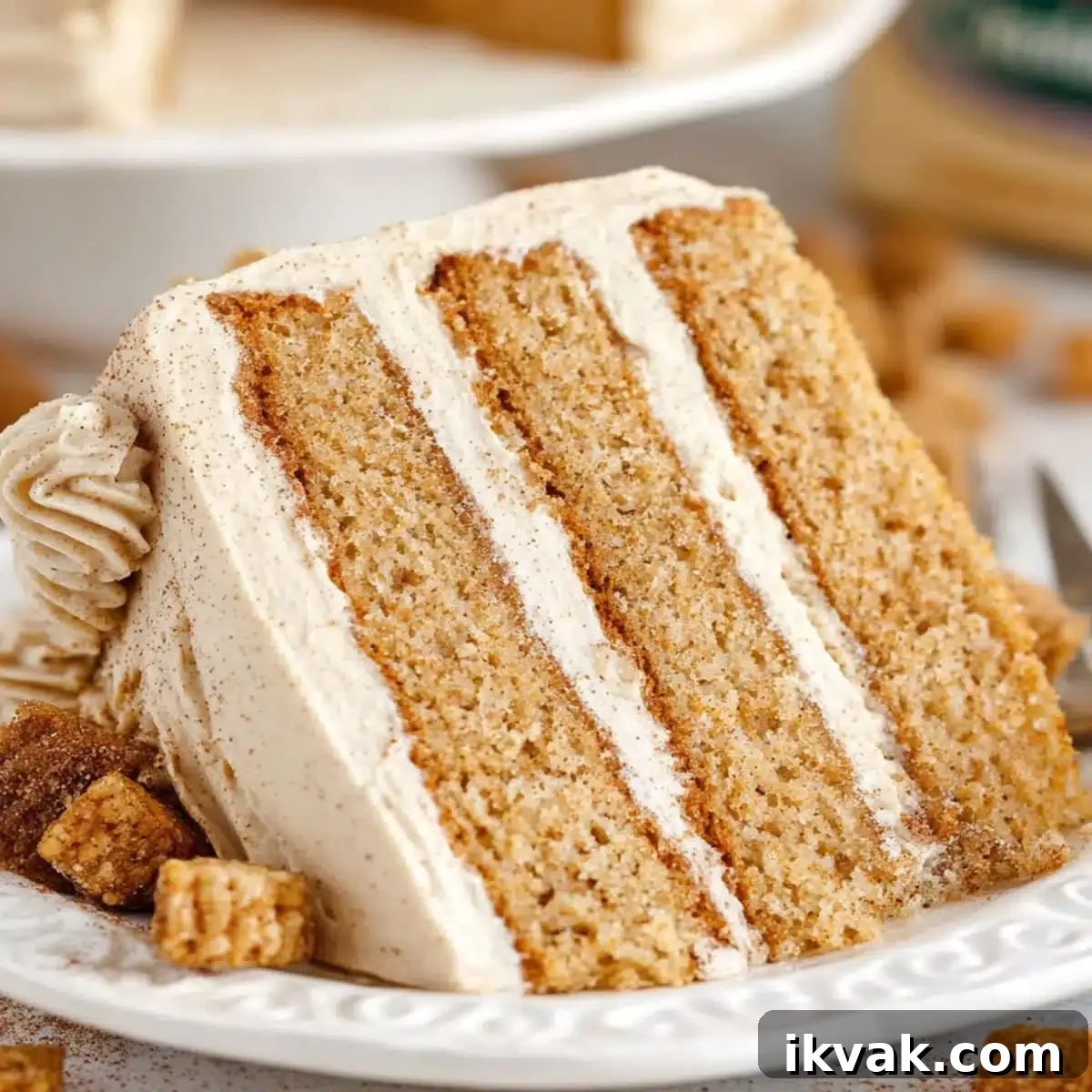 Churro Cake Recipe: Crispy Cinnamon Dessert for Sweet Lovers 3 Three-layer churro cake with cinnamon sugar frosting and churro topping on a cake stand