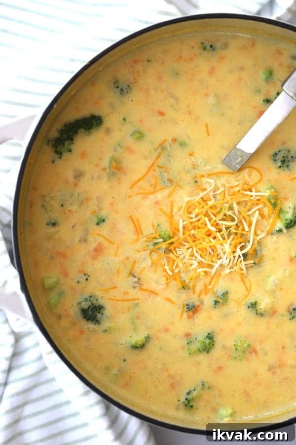 Creamy Broccoli Potato Cheese Soup Recipe for Comforting Meals 5 broccoli cheddar and potato soup recipe in a large white dutch oven.