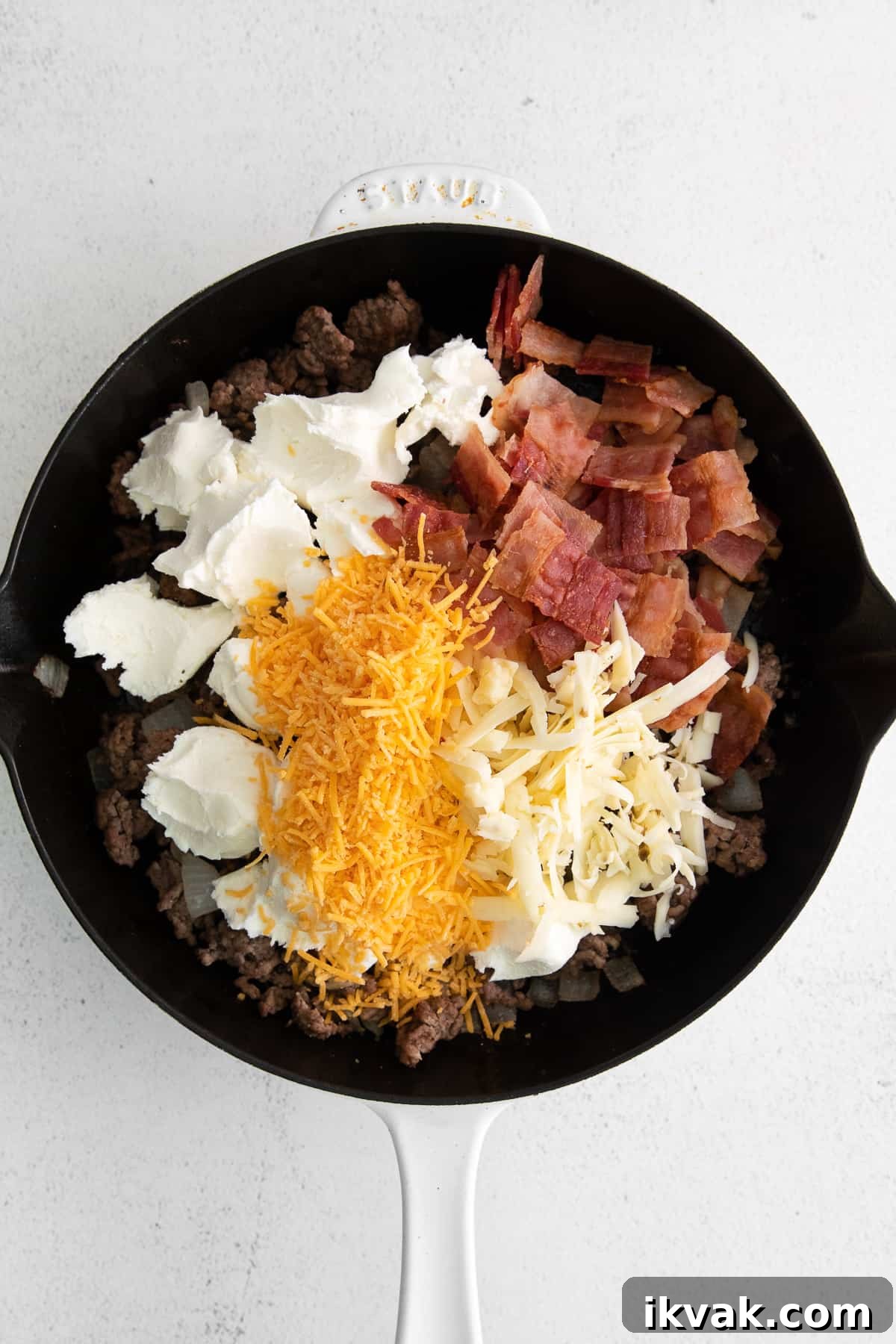 Loaded Cheeseburger Dip Recipe: Crowd-Pleasing Party Appetizer 5 Ingredients for the cheeseburger dip in a skillet.