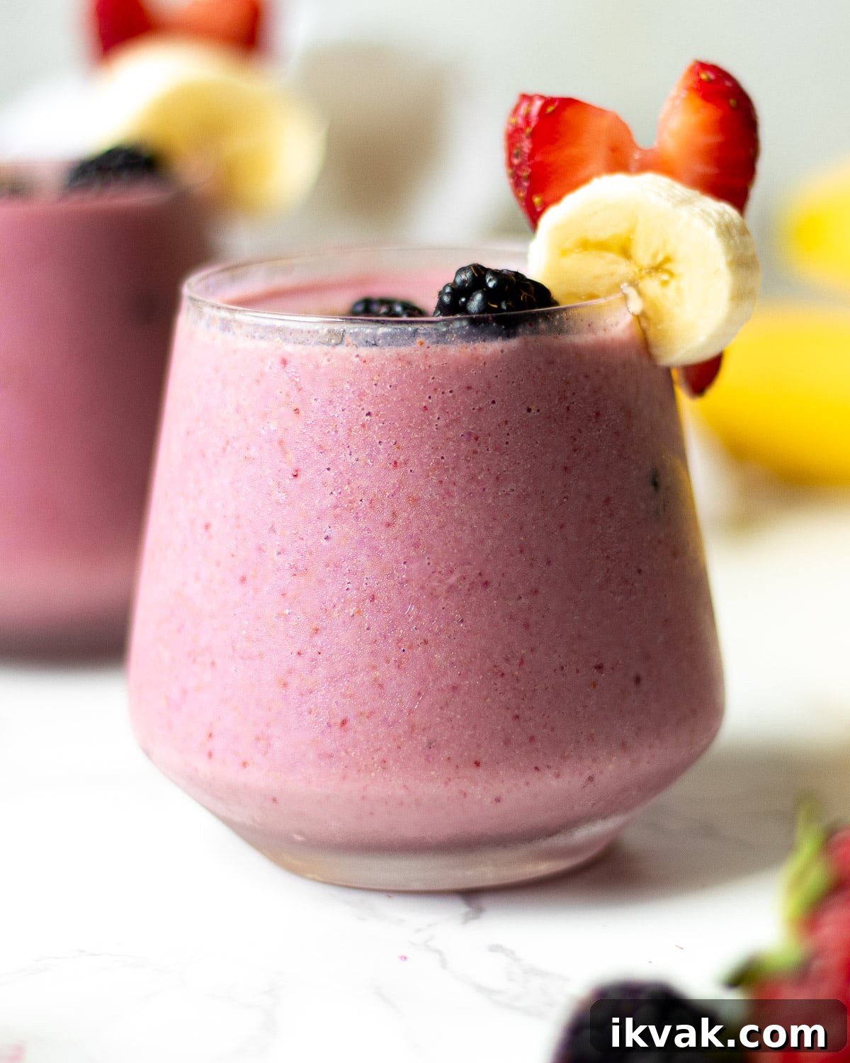 Creamy Blackberry, Strawberry & Banana Smoothie Recipe 5 blackberry strawberry banana smoothie in glasses with fruit garnish