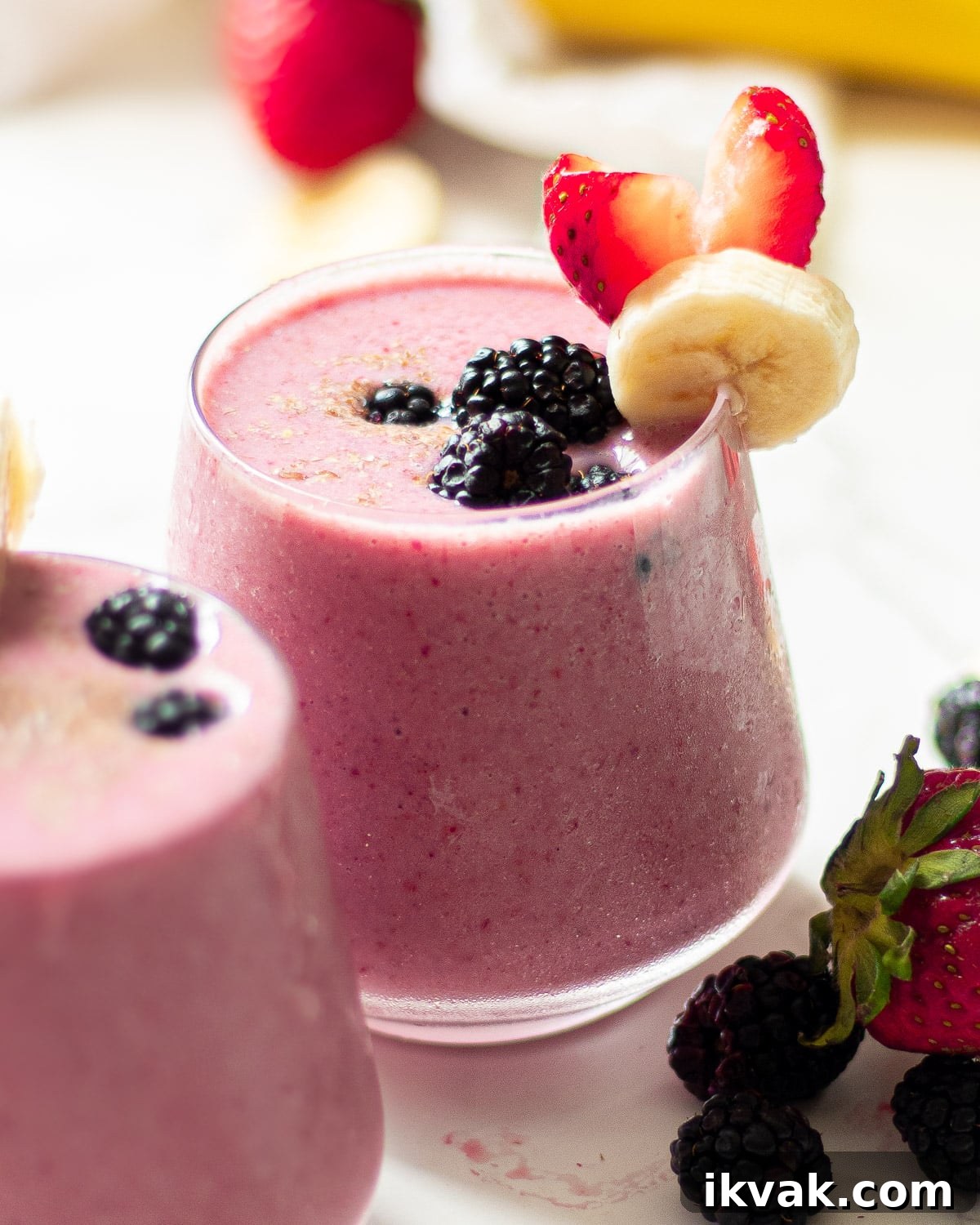 Creamy Blackberry, Strawberry & Banana Smoothie Recipe 6 blackberry strawberry banana smoothie in glasses with fruit garnish