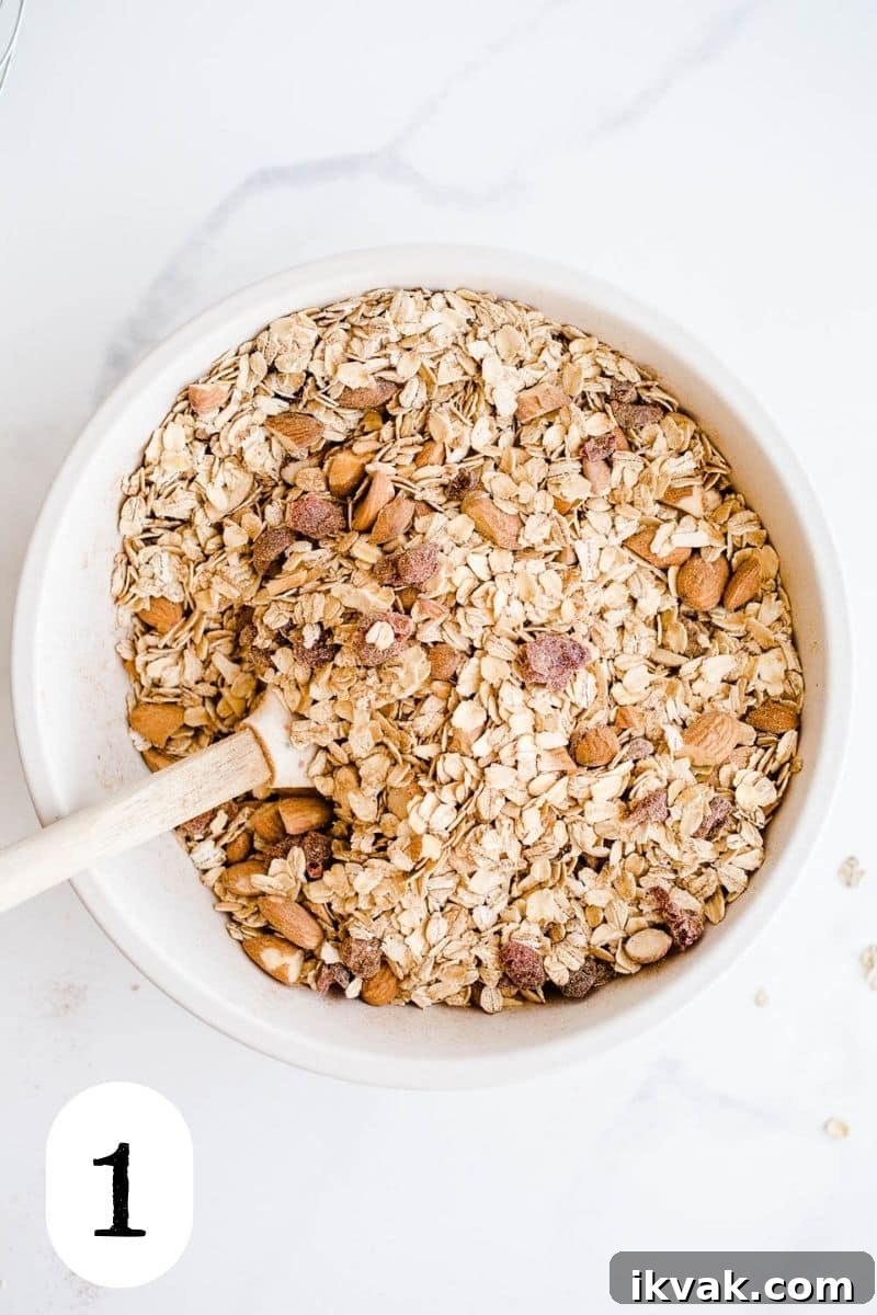 Oats and almonds in a mixing bowl. 