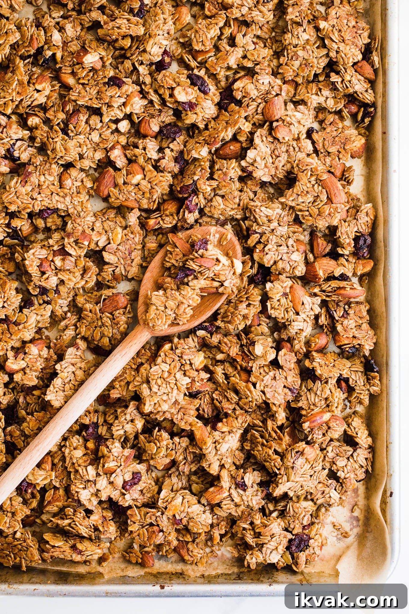 Clusters of granola on a sheet pan.