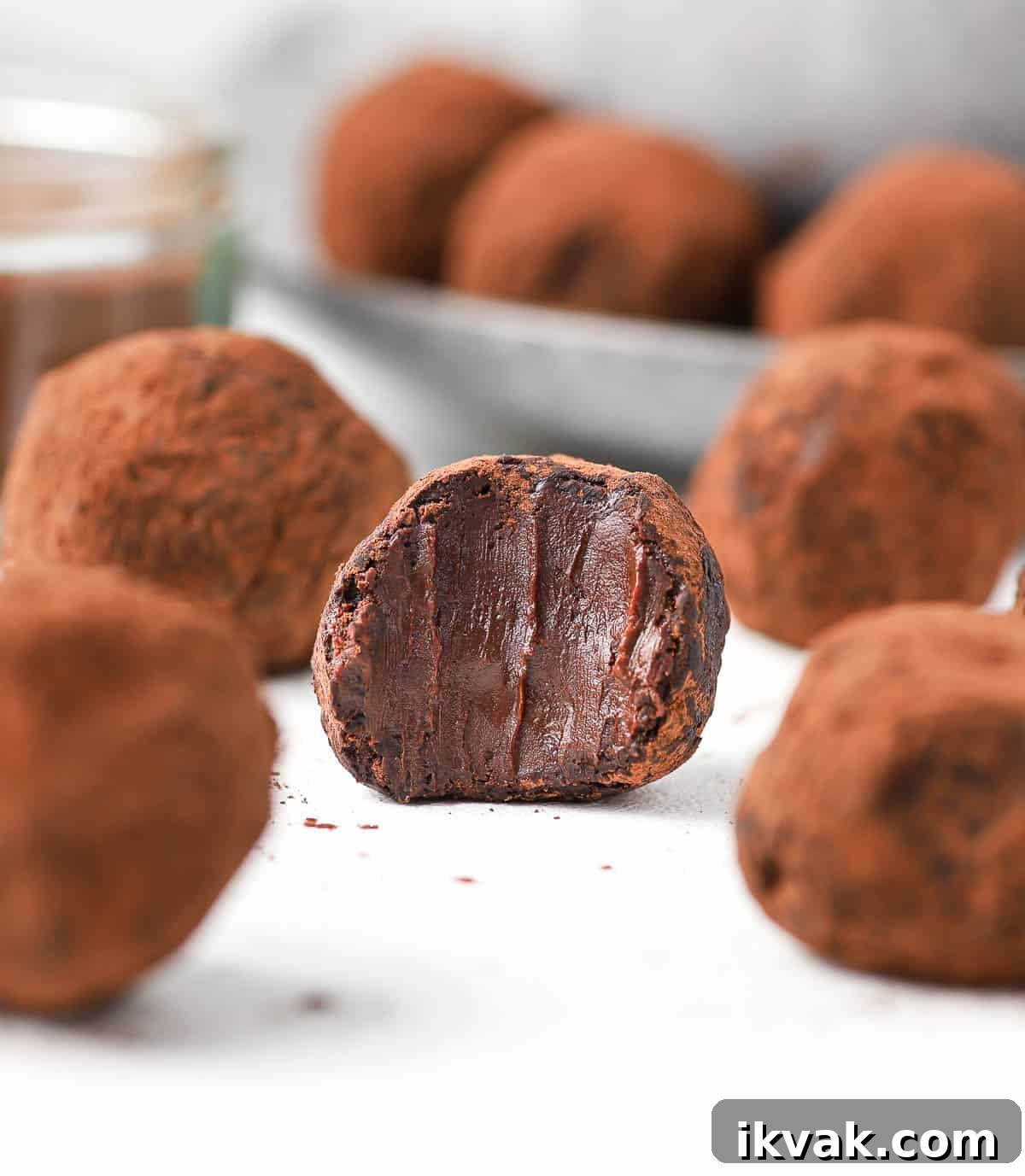Close up on one truffle with a bite taken off.