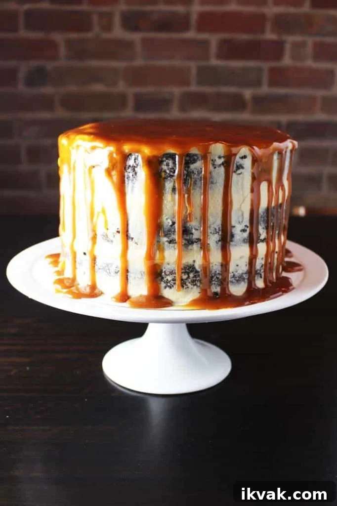 Caramel chocolate cake on a plate with coconut caramel frosting and caramel drizzle 