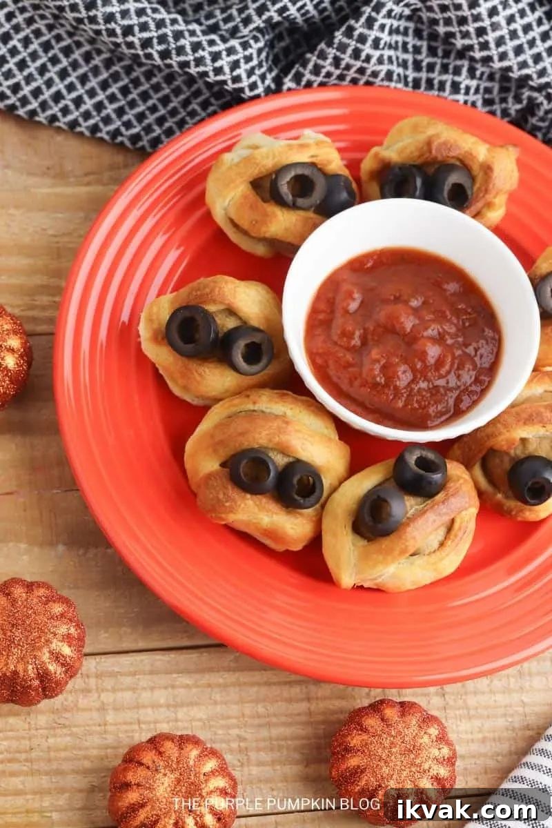 27 Spooky Halloween Appetizers Adults Will Love 13 11. Mummy Meatballs with Marinara Sauce