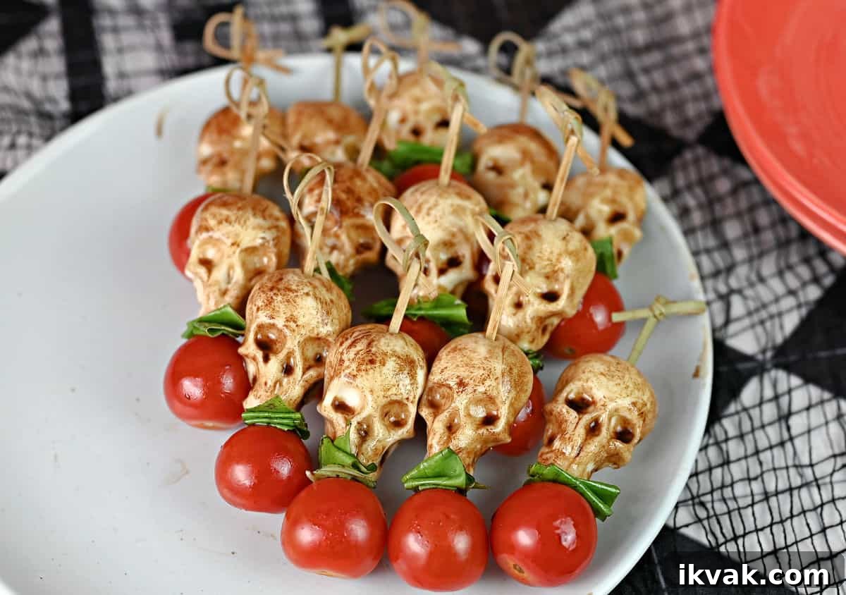 27 Spooky Halloween Appetizers Adults Will Love 28 26. Skull Caprese Skewers