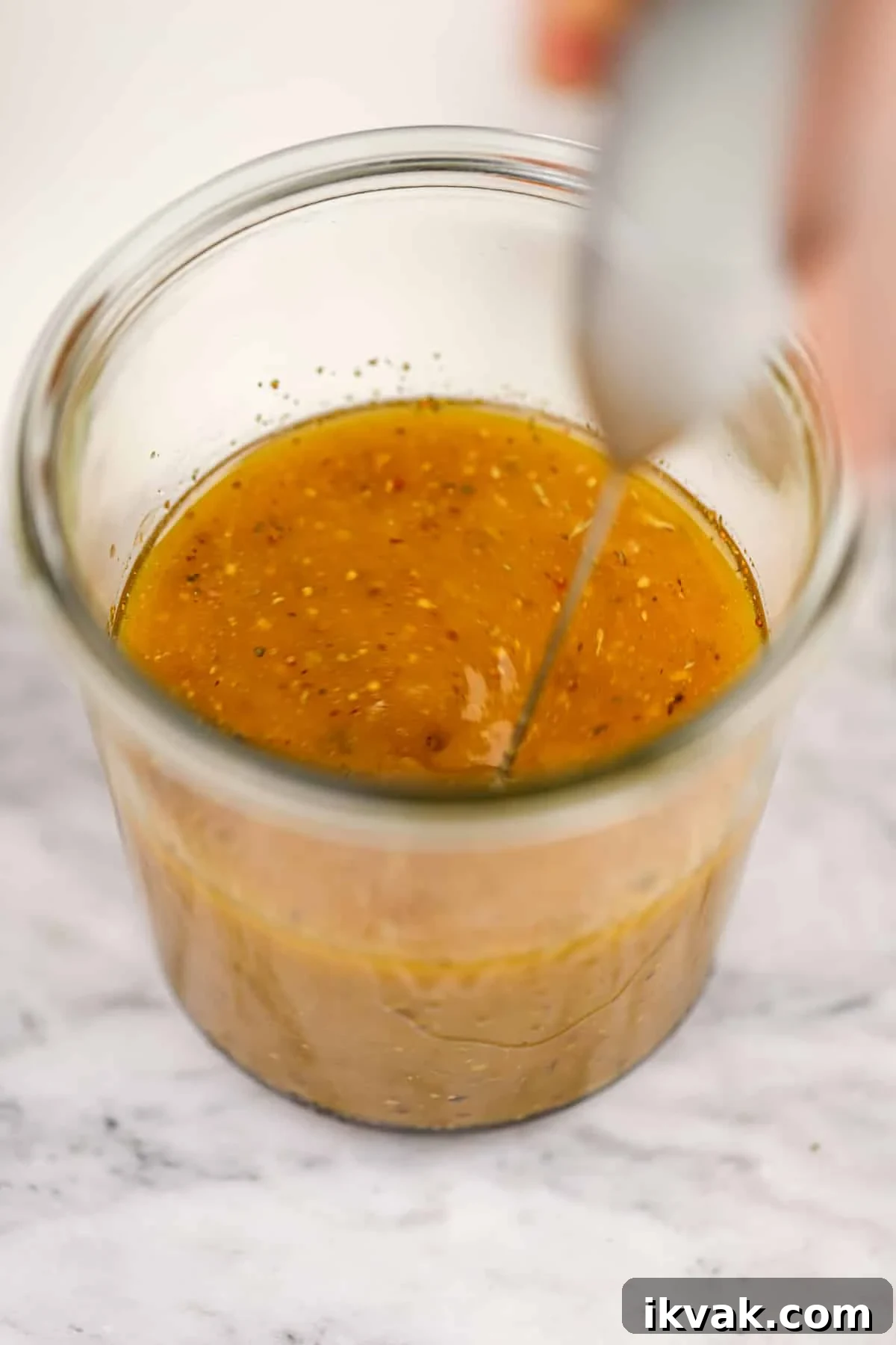 A small frothing want emulsifying a homemade dressing.