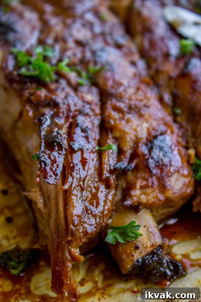 closeup of slow cooker spare ribs garnished with fresh herbs