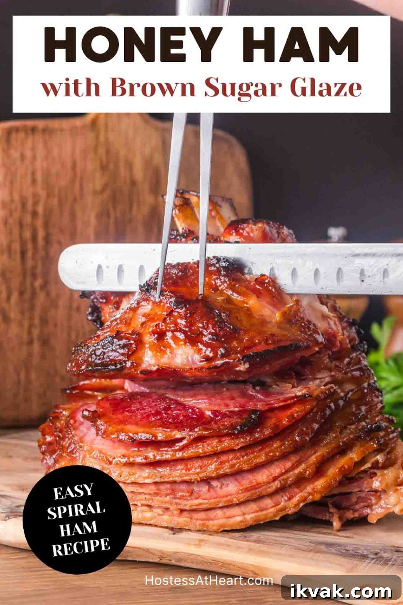 Honey-Baked Ham with Brown Sugar Glaze Recipe 12 An image for Pinterest of a whole honey baked ham on wooden cutting board ready to slice showing caramelized exterior - Hostess At Heart