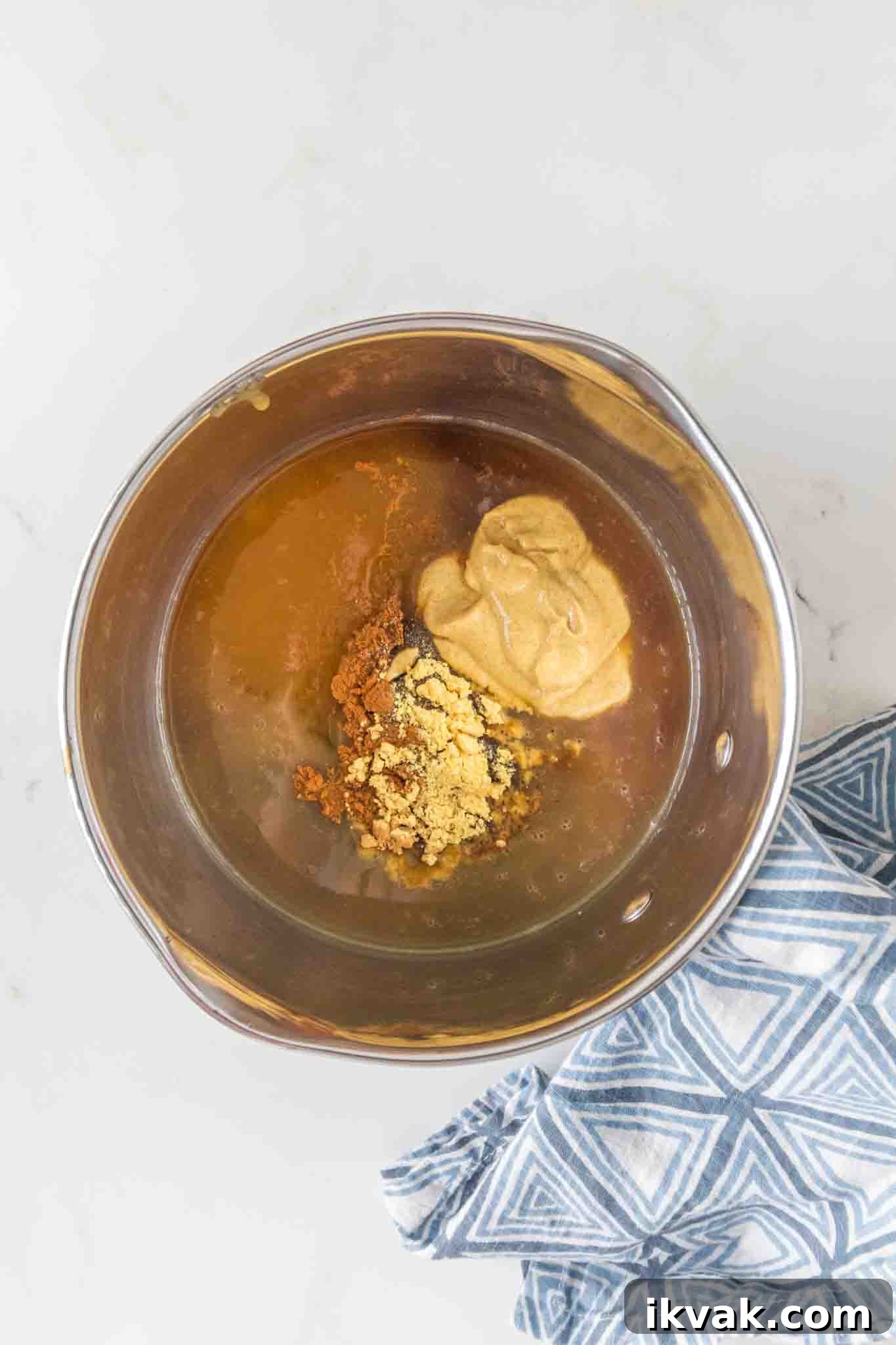 Honey-Baked Ham with Brown Sugar Glaze Recipe 5 Brown sugar glaze in saucepan with honey and spices for glazed ham recipe - Hostess At Heart
