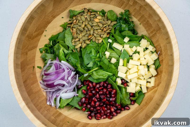 Crisp Kale and Spinach Salad with Cheddar and Pepitas 5 Adding the ingredients to a bowl
