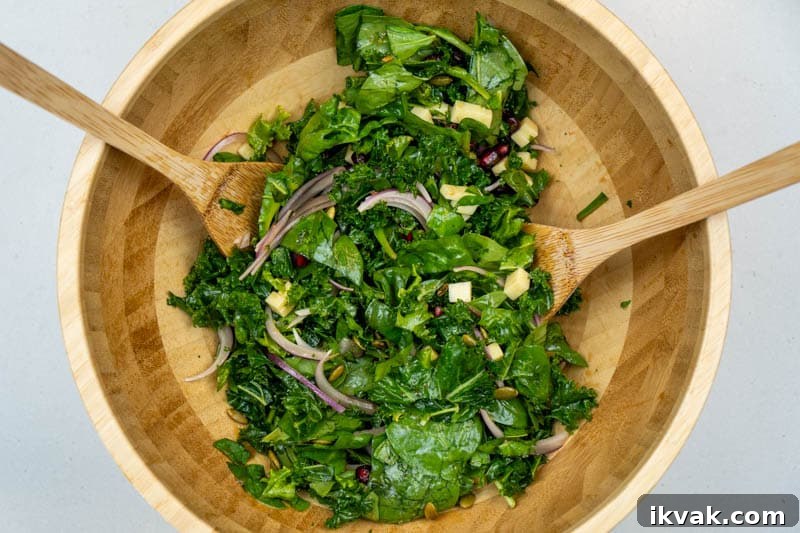 Crisp Kale and Spinach Salad with Cheddar and Pepitas 6 Tossing the salad together