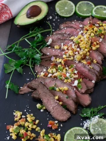 Flank steak topped with feta cheese and corn salsa.