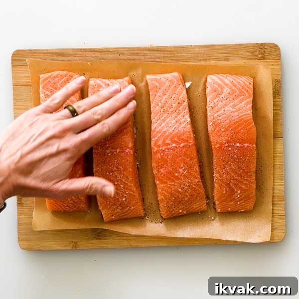 Honey Garlic Pan-Seared Salmon in a HexClad Skillet 6 Seasoning salmon with salt and pepper.