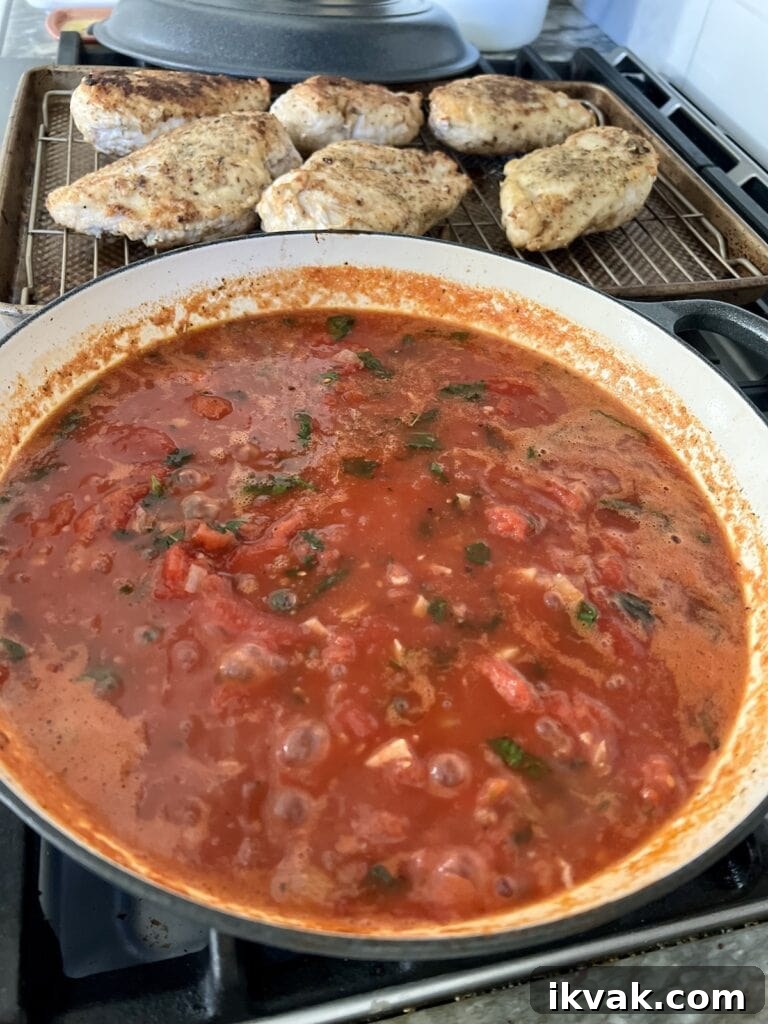 Pomodoro Chicken sauce simmering in pan.