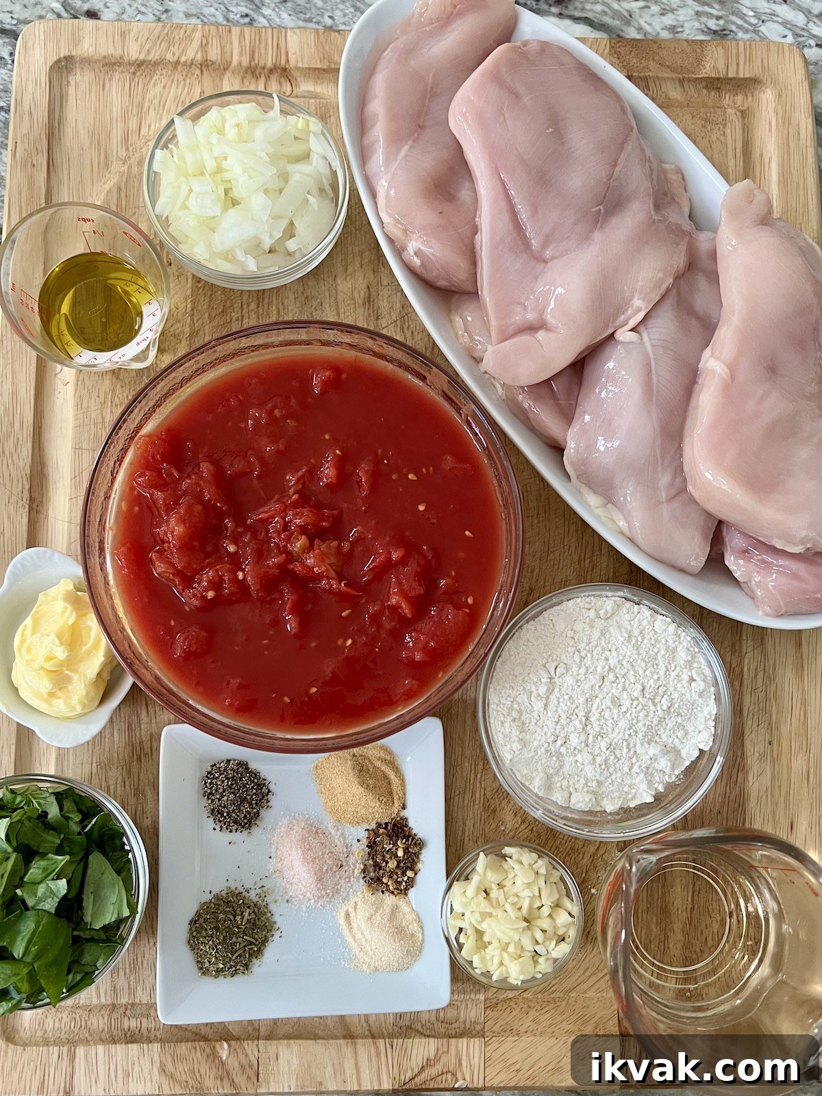 All prepped ingredients for One Pan Chicken Pomodoro recipe on cutting board.