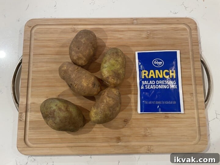 ingredients for roasted ranch potatoes on cutting board