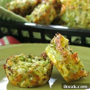 Two broccoli muffins on plate with a basket of muffins behind them.