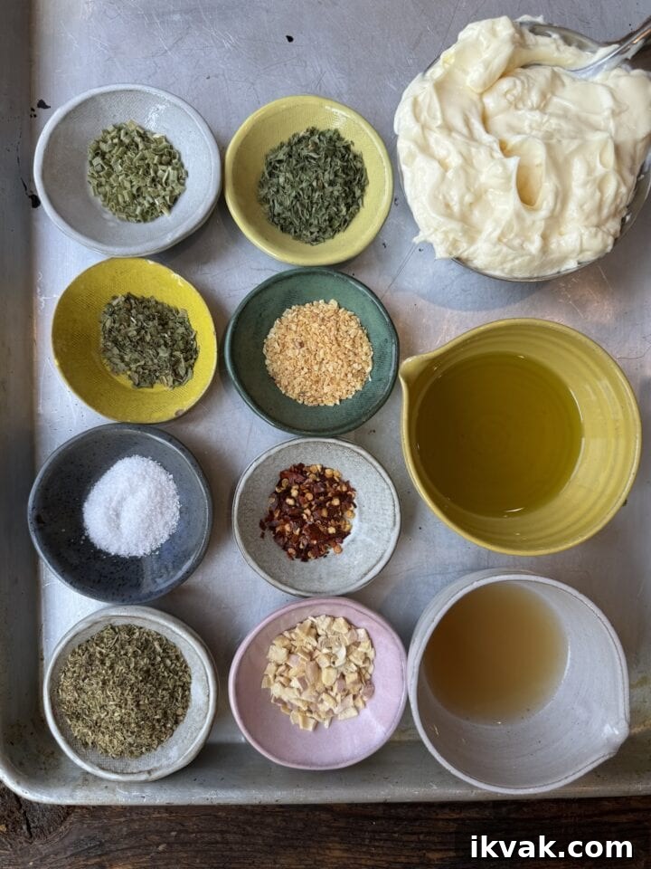 Dried herbs, spices, and infused liquids for cooking or seasoning. Fresh ingredients arranged for a culinary recipe.