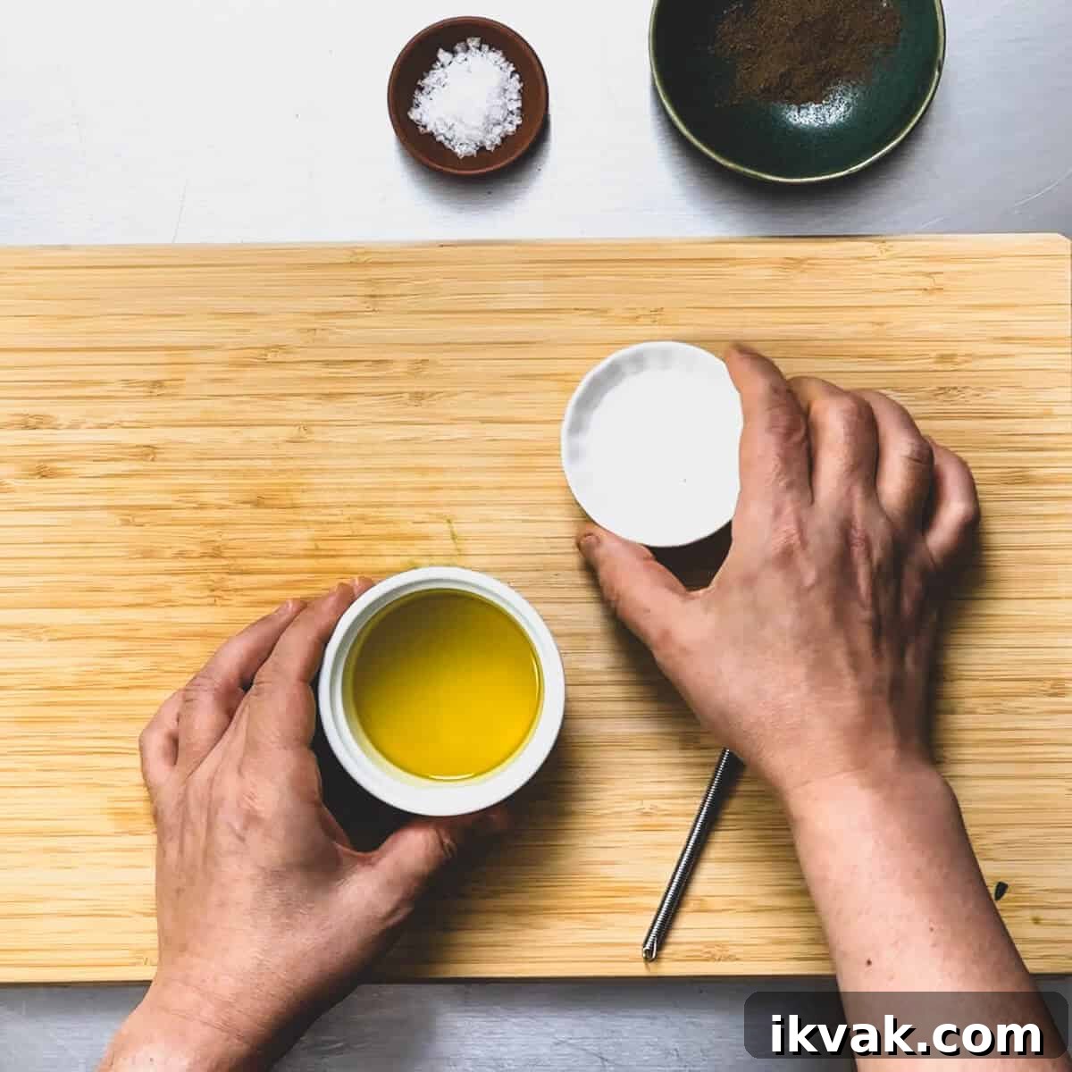 olive oil and vinegar about to be mixed for a dressing.