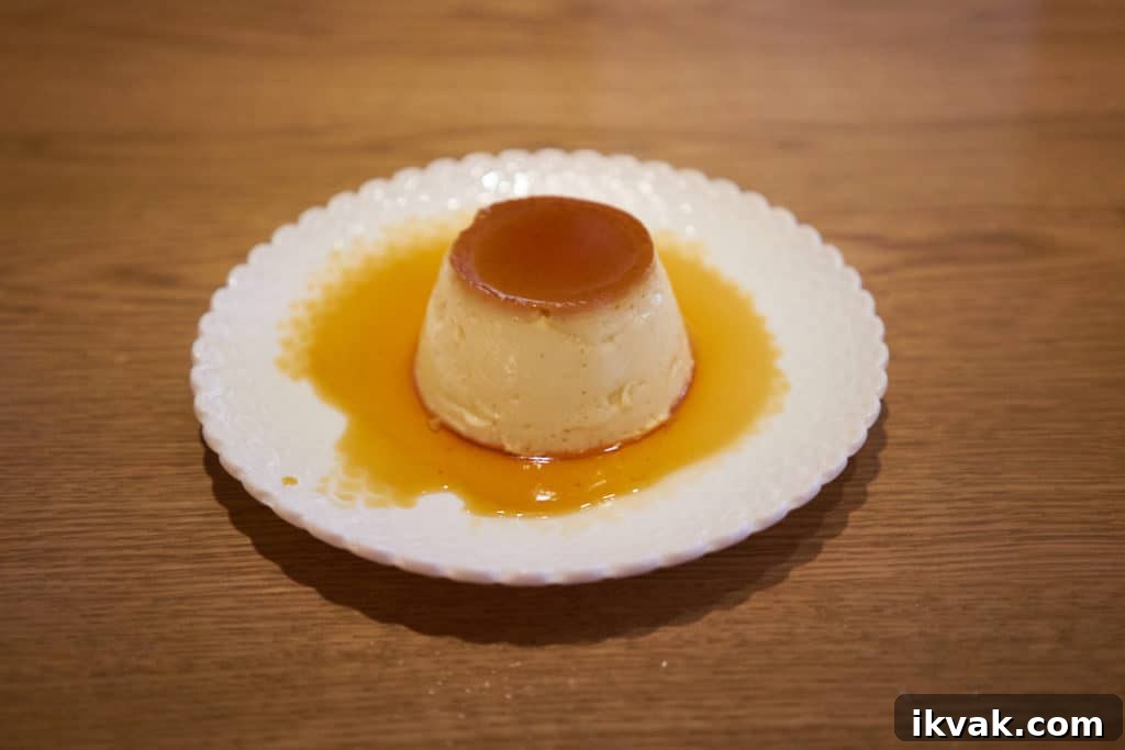 A flan dessert on a white plate.
